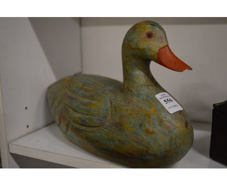 Carved and painted wooden model of a duck.