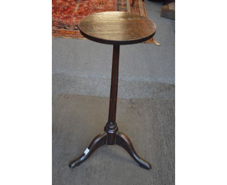 An early primitive oak tripod candle stand.