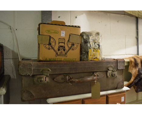 An old projector and a suitcase.