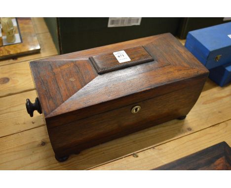A Victorian rosewood sarcophagus shaped tea caddy.