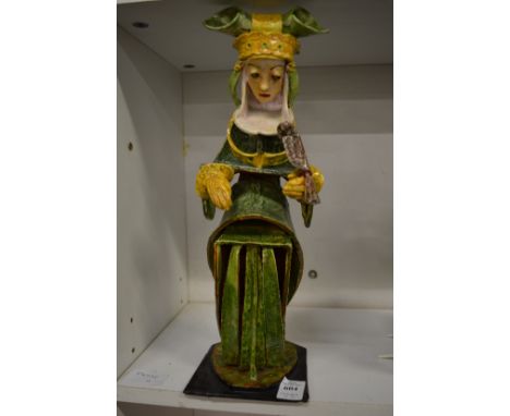 E Millicent Rhodes, 'Gay Goshawk' an unusual pottery model of woman holding a hawk on her hand together with a small pottery 
