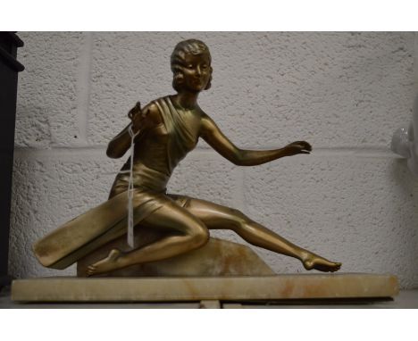An Art Deco silvered metal model of a young lady on a marble base.