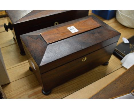 A Victorian rosewood sarcophagus shaped tea caddy.