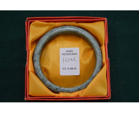 A jade bangle, boxed.