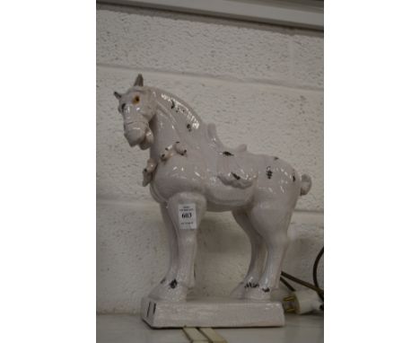 A white glazed pottery Tang style model of a horse.