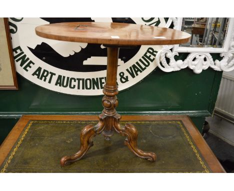 A Victorian inlaid walnut tripod table.