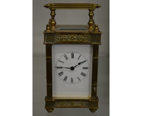 A brass carriage clock.