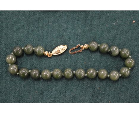A jade bead bracelet.