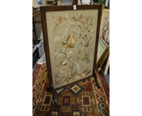 Mahogany framed fire screen with silk work embroidered panel.