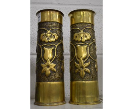 A pair of first World War trench art brass shell cases.