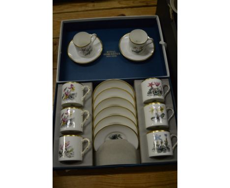 Boxed set of Royal Worcester coffee cups and saucers and a pair of similar cups and saucers.