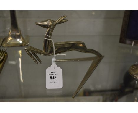 Hagenaur, a stylish silver plated model of a leaping deer.