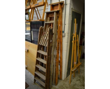 Three old builders step ladders.