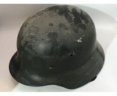 A German Third Reich Army helmet M35 pattern with a leather liner and stamped number 20212.