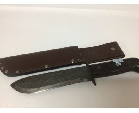 A British Military knife with leather scabbed both knife and scabbard with military marks and makers marks FE Hopkinson Ltd J