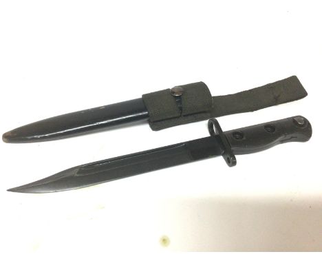 A British SLR bayonet believed to be a Falklands war relic stamped LIA3 9600257 D67 with scabbard and woven frog.