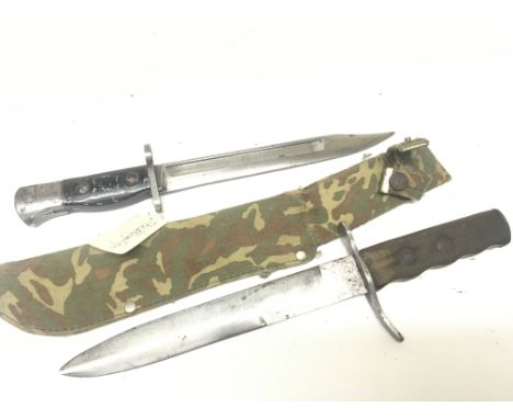 A Military fighting knife with camouflage scabbard and a bayonet possible for SLR stamped Lia3 9600257. (2)
