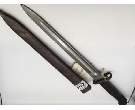 A British bayonet conforming to 1907 pattern with metal scabbard. The top handle grip fitting stamped 17190. Length 45cm