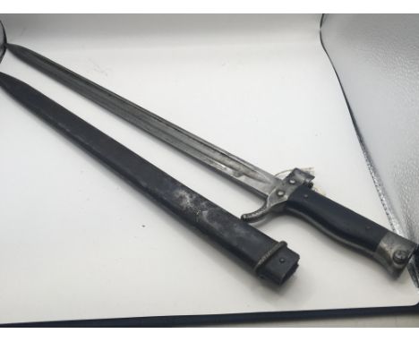 A Military bayonet possible French with an ebony wood grip conforming serial numbers on the quilon and metal scabbard length 