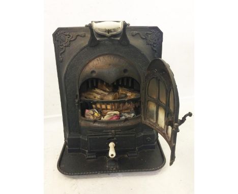 La Salamandri Cast Iron Stove marked to rear E CCharboche, 33-45 Rue Robier Paris, with ceramic fittings, hinged front cover,