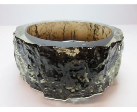 WHITEFRIARS GLASS, a sculptured surround dark glass ashtray 