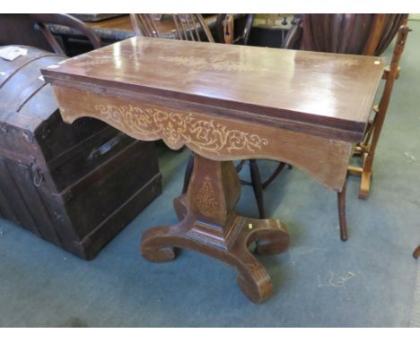 A MARQUETRY MAHOGANY PEDESTAL CARD TABLE, on 4 scroll legs