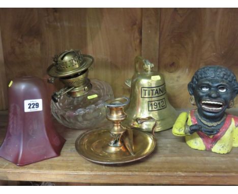 CRANBERRY GLASS LIGHT SHADE, cast iron negroid "Dinah" money box, cut glass oil lamp reservoir, Titanic bell and chamber stic