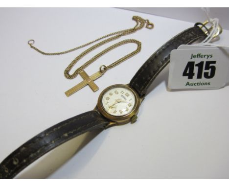 GOLD CROSS, 9ct gold crucifix with engine turned decoration on a fine link chain; also Technos ladies gold cased wrist watch 