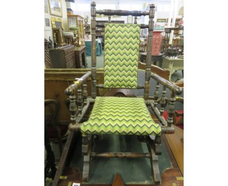 AMERICAN-STYLE CHILD'S ROCKING ARMCHAIR, bobbin frame with tapestry upholstery