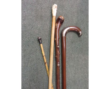 WALKING CANES, carved ivory bear motif walking cane, 2 others and swagger stick 