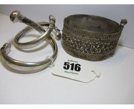 SILVER BANGLES, Yememi hinged silver bangle, together with 2 other slave bangles