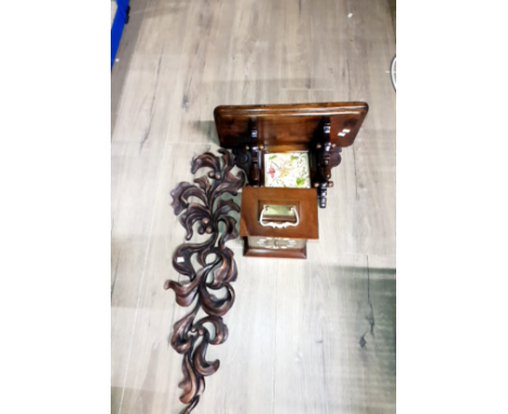 A CLOCK WITH WALL BRACKET AND ORNATE CARVING