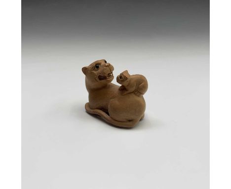 A Japanese carved wood netsuke, signed, width 4.5cm.