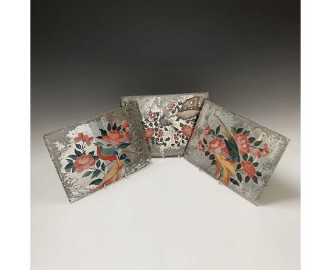 Three Chinese painted mirrors, early 19th century, each panel with a bird perched on either a branch or a rocky outcrop, 21 x