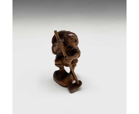 A Japanese carved wood netsuke, signed, 20th century, height 5.5cm.