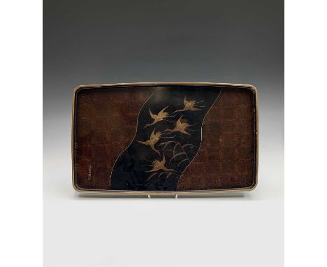A Japanese lacquered tray, 19th century, signed, the centre with a shaped black panel with cranes in flight, 32 x 53cm.