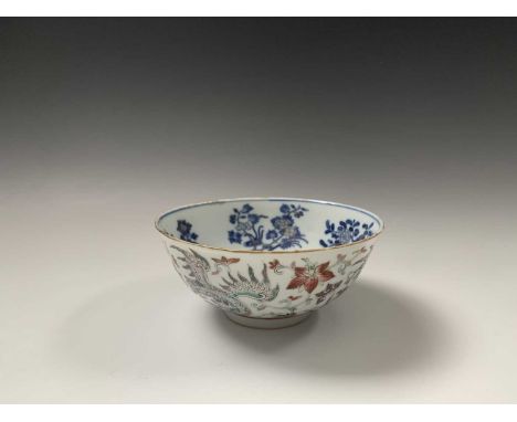 A Chinese porcelain bowl, Daoguang mark and period, 1821-1850, the ivory exterior with enamel decorated phoenix amongst scrol