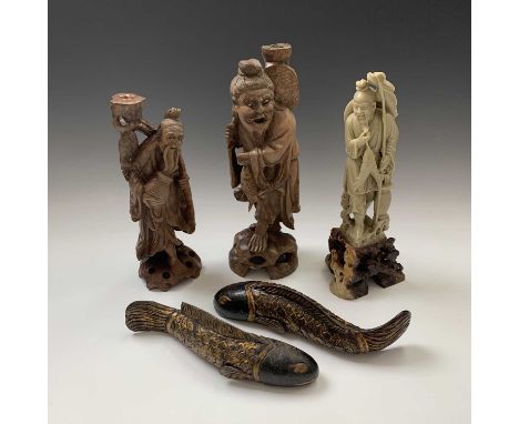 A large Chinese soapstone figure of a fisherman, early 20th century, two carved wood figure lamp bases and two carved wood mo