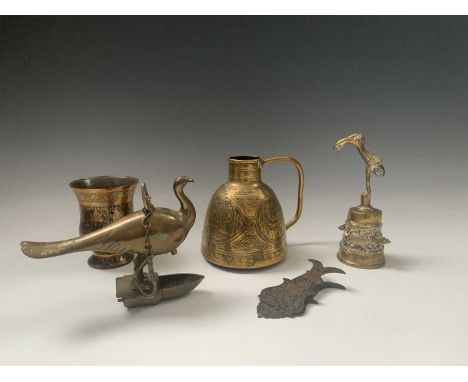 A Persian brass hanging oil lamp, width 17.5cm, a Cairoware brass jug, height 14cm and three Indian brass items.