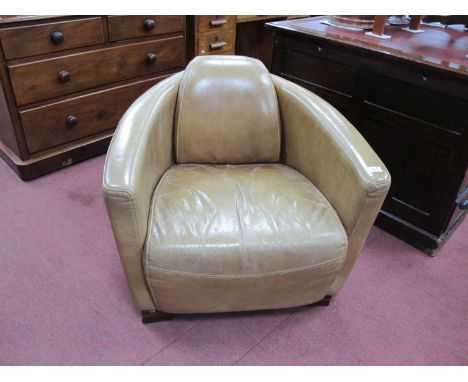 Halo Light Bown Leather Armchair, in the Art Deco manner.