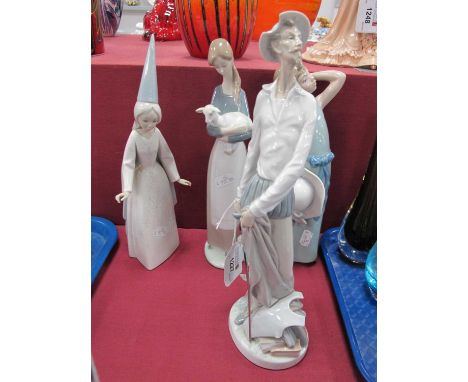 Lladro Pottery Figurines, including Swordsman, 29.5cm high, girl holding lamb. (4).