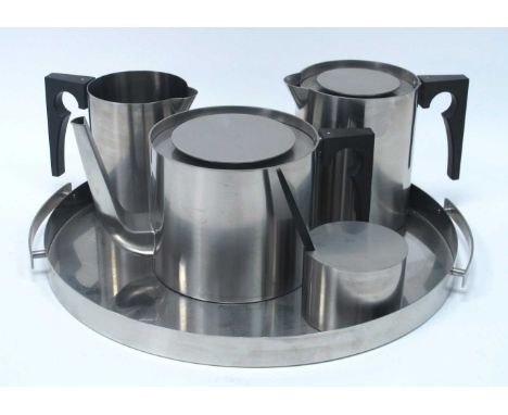 Arne Jacobsen for Stelton, Denmark, cylinder line stainless steel four-piece tea service, together with tray (5).