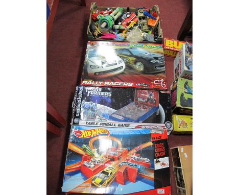 Micro Scalextric rally racers, Hot Wheels cross, cross, crash, Transformers pinball game together with a box of juvenalia inc