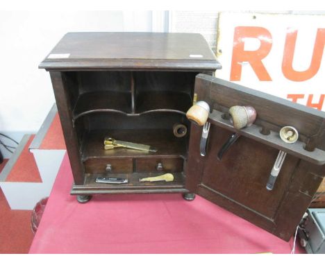 XVII Century and Later Oak Smokers Cabinet, top with a moulded edge, lozenge panelled door, interior with two drawers, pipe s