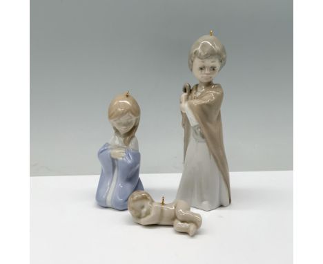Joseph and Mary tenderly admire Baby Jesus as he peacefully rests. Lladro backstamp. Dimensions of the largest item: 1.25"L x