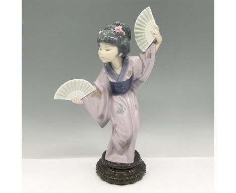 Glossy figural of dancing Japanese woman holding two fans. Dressed in a lavender butterfly pattern kimono. Lladro backstamp. 