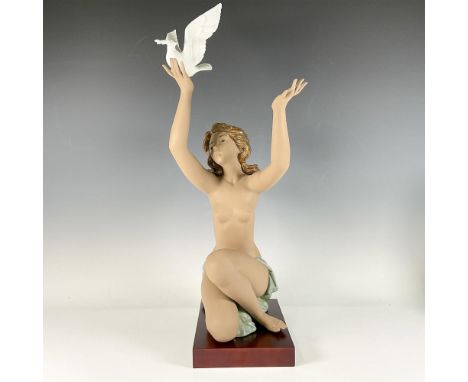 A matte sculpture featuring a kneeling female figure, her arms outstretched, adorned with a green sash around her hips, relea