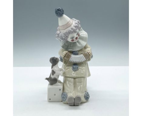Glossy figural playing his instrument for his dog. Lladro backstamp. This item has its original box: 8"L x 5.5"W x 5"H. Artis