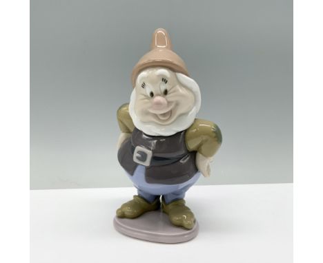 Happy from Disney's Snow White, cheerfully posing with hands on hips. Lladro backstamp. This item has its original box which 
