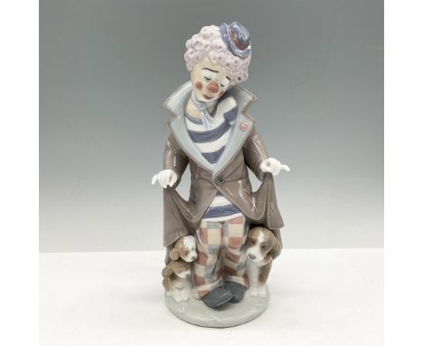 Glossy figure in colorful attire with three shy puppies. Lladro backstamp. This item has its original box: 13"L x 7"W x 6"H. 